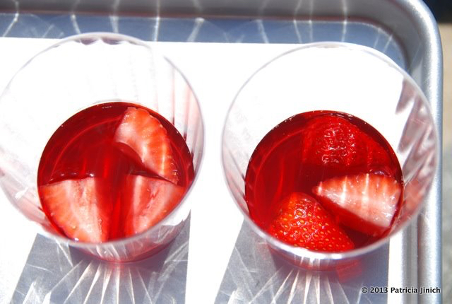 strawberry jello mixture in cups