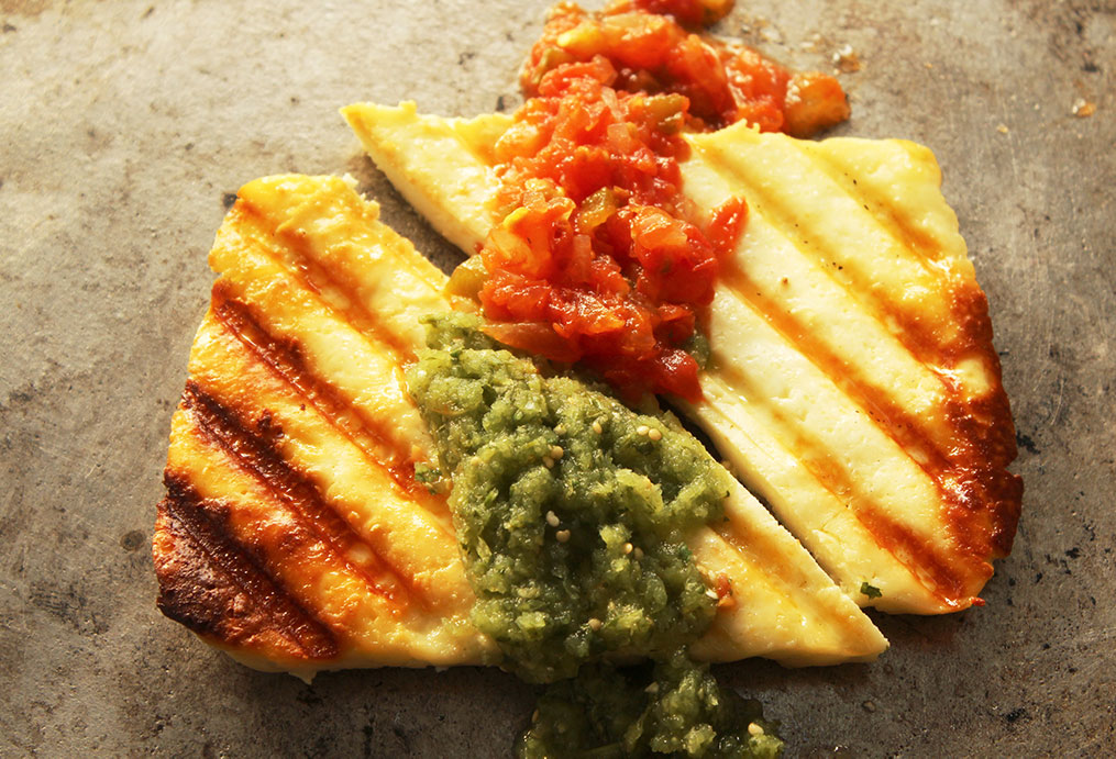 grilled panela cheese with salsa verde and salsa rojo