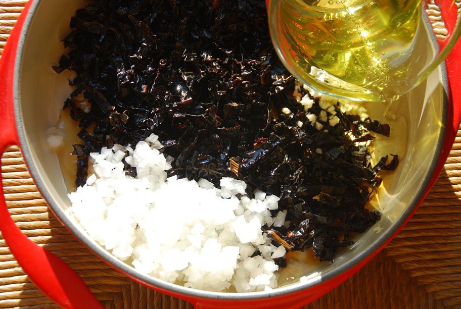 adding oil to ancho chile salsa ingredients